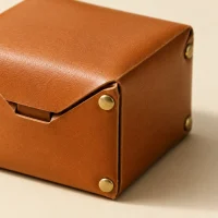 Box Coin Purse, close-up of the rivet and folded edge