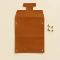 Clasp unfolded flat, showing the die-cut blank