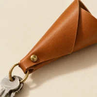 Cone Key Pouch, close-up of the rivet and folded edge