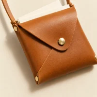 Neck Envelope, close-up of the rivet and folded edge