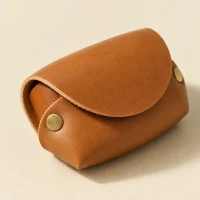 Pebble Coin Purse, close-up of the rivet and folded edge