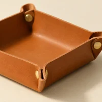 Tray Coin Purse, close-up of the rivet and folded edge