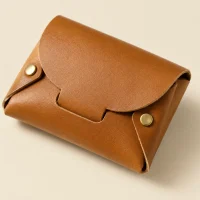 Tuck Coin Purse, close-up of the rivet and folded edge