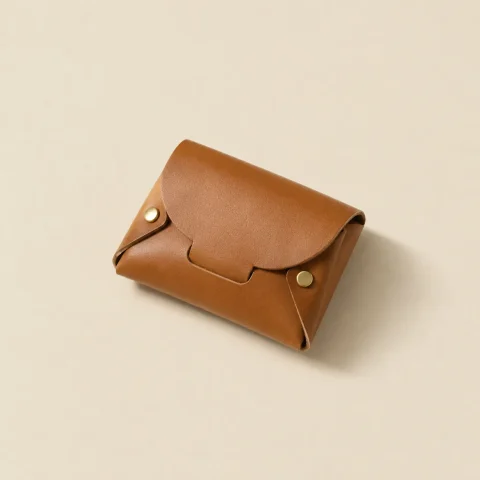 Tuck Coin Purse, folded, studio photo